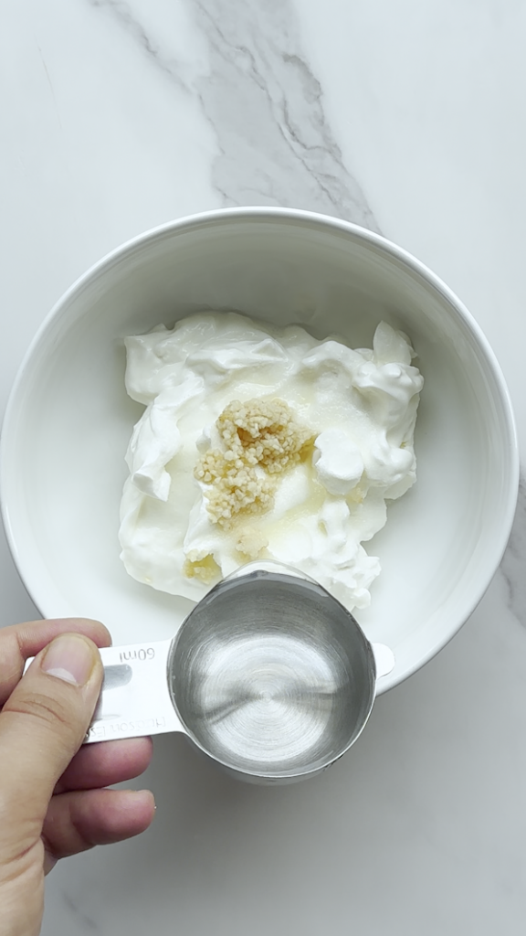 sour cream being made from sour cream and garlic and water